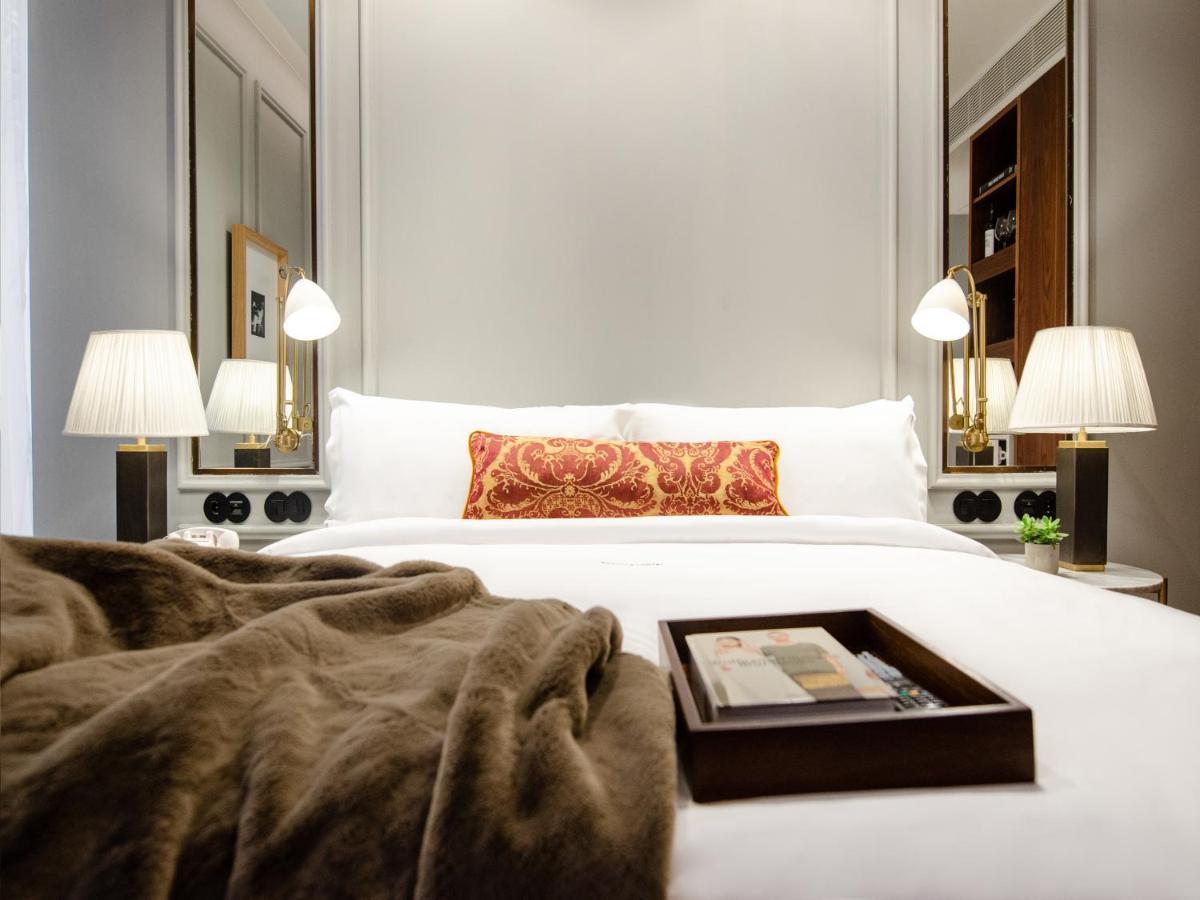 Browns Avenue Hotel Lisboa Dış mekan fotoğraf A bedroom at The Hari